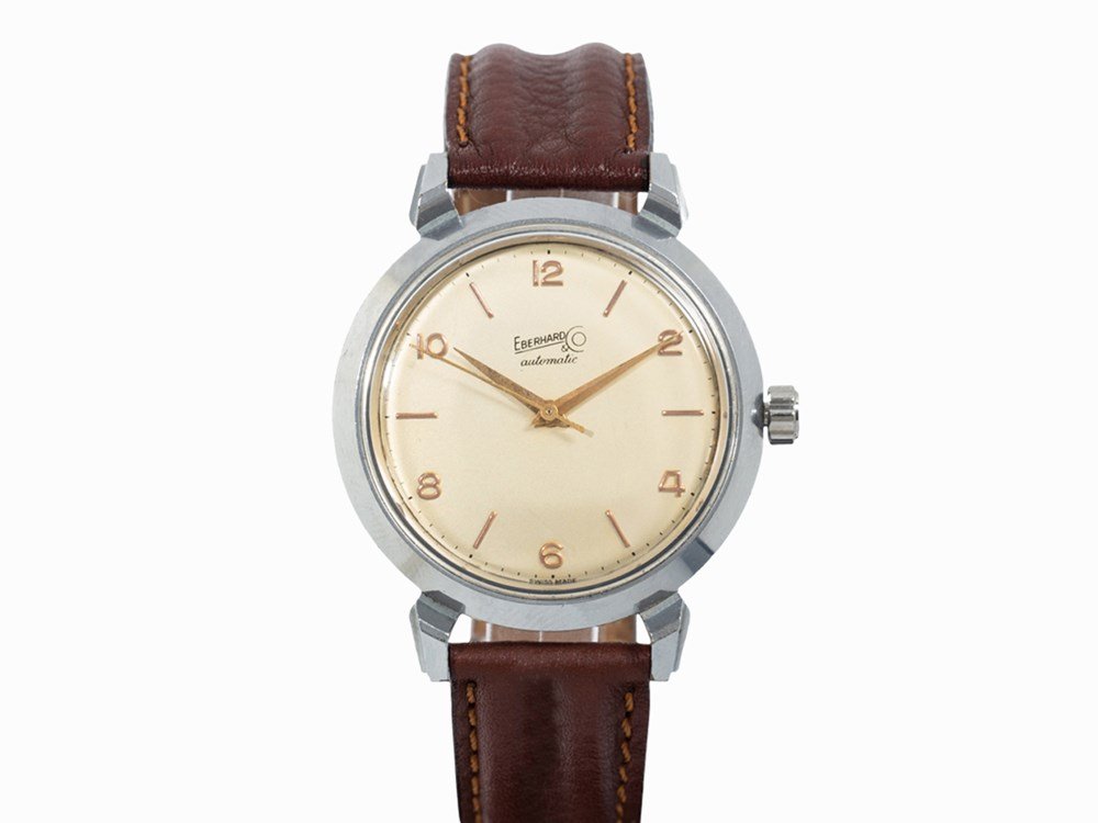 Eberhard & Co Automatic, Switzerland, c. 1960: Eberhard & Co Automatic Switzerland, c. 1960 Automatic movement, calibre 14’’’; 27 jewels, hour, minute, second Gold dial, gold Dauphine hands Watch case of stainless steel Brown leather strap w