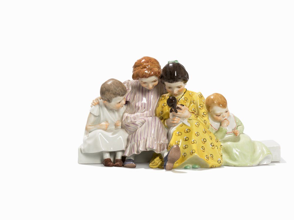 Konrad Hentschel, 'Vier Kinder mit Puppe', Meissen, c.: Porcelain, polychrome and gold painted Meissen, c. 1930 Porcelain Manufactory Meissen, established in 1710 Model: Konrad Hentschel (1872-1907), 1906 Underglaze blue crossed sword mark, incised model m