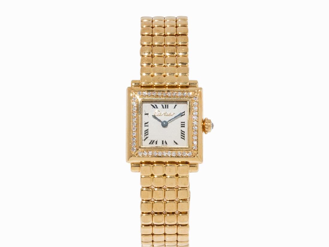 Cartier Diamond and Gold Lady’s Watch, c. 1985: Cartier Diamond and gold lady’s watch Switzerland, c. 1985 Quartz movement, hour, minute Silver dial, blued hands Watch case, original strap and folding clasp of 18K gold Watch case edge set with di