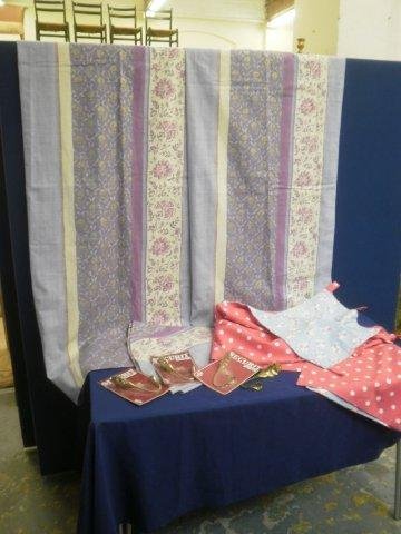 A pair of tab top curtains with matching circular : A pair of tab top curtains with matching circular tablecloth, a single tab top curtain in two Cath Kidston designs, four unused metal curtain tie backs and an assortment of castor cups.