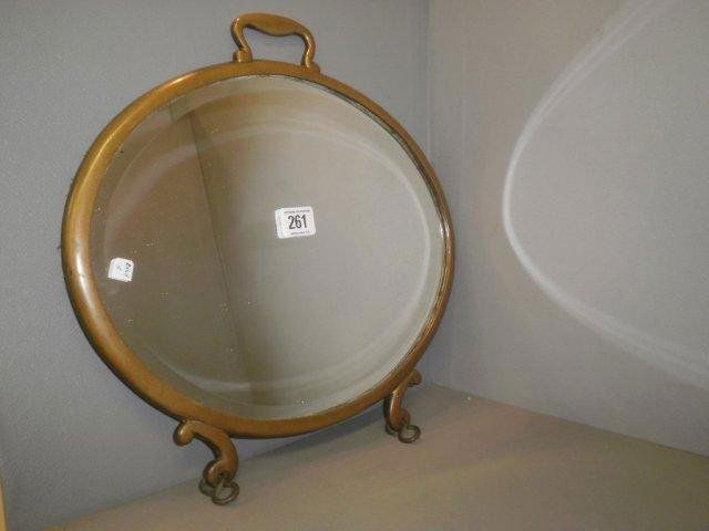 An Arts & Crafts brass framed barber's hand held m: An Arts & Crafts brass framed barber's hand held mirror.