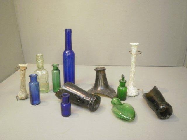 An assortment of collectors bottles of unusual for: An assortment of collectors bottles of unusual form including two Roman phails.