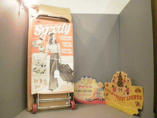 A 1970's 'Speedy' luggage trolley with original c: A 1970's 'Speedy' luggage trolley with original cardboard advertising slip and two Pifco cardboard light advertisements.