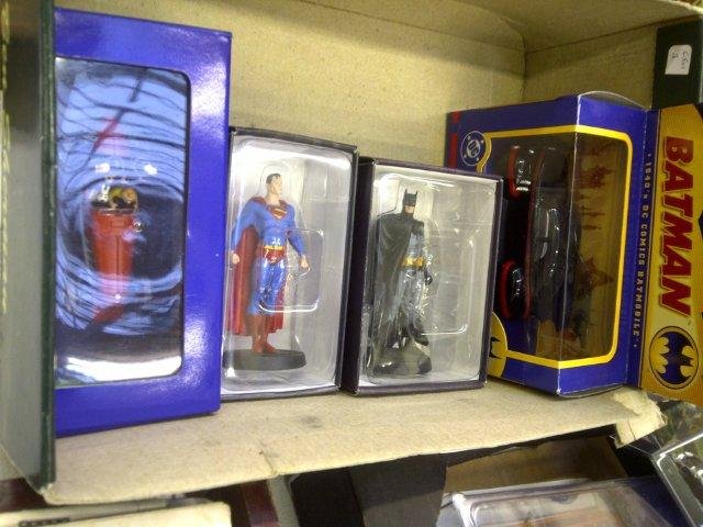 A Corgi boxed Batmobile, a TinTin collector's boxe: A Corgi boxed Batmobile, a TinTin collector's boxed car and two cast metal figures: Batman and Superman.