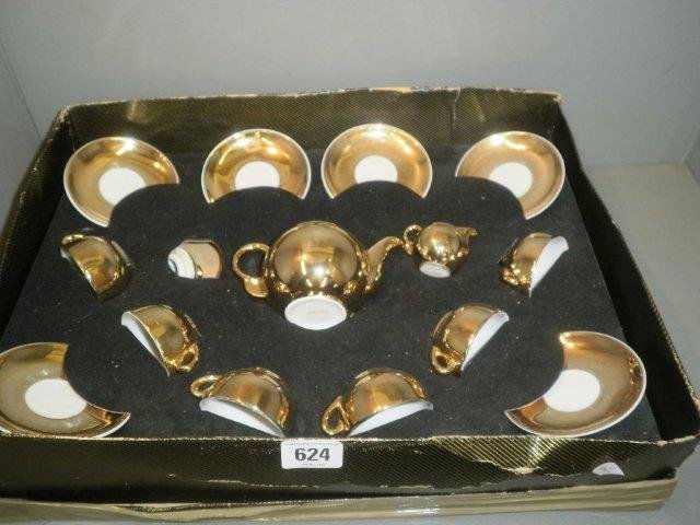 A gilt decorated 1960's childs tea set.: A gilt decorated 1960's childs tea set.