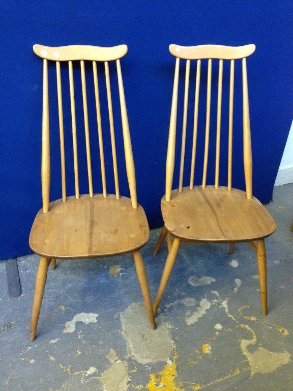A pair of Ercol spindle high back dining chairs.: A pair of Ercol spindle high back dining chairs.