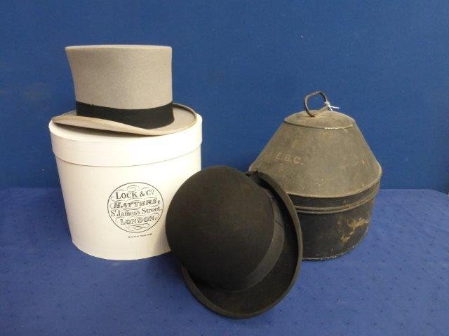 A good bowler hat by Saml. Mortlock & Son, 95: A good bowler hat by Saml. Mortlock & Son, 95 Gracechurch St. London in a toleware tin hat box, monogrammed E.B.C, and an Austin Reed of Regent St. top hat in a Lock & Co. hat box.
