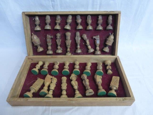 A decorative carved wooden chess set.: A decorative carved wooden chess set.