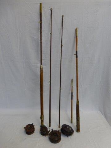Three wooden fly fishing reels, an Allcock Aerialite: Three wooden fly fishing reels, an Allcock Aerialite reel and two cane fishing rods.
