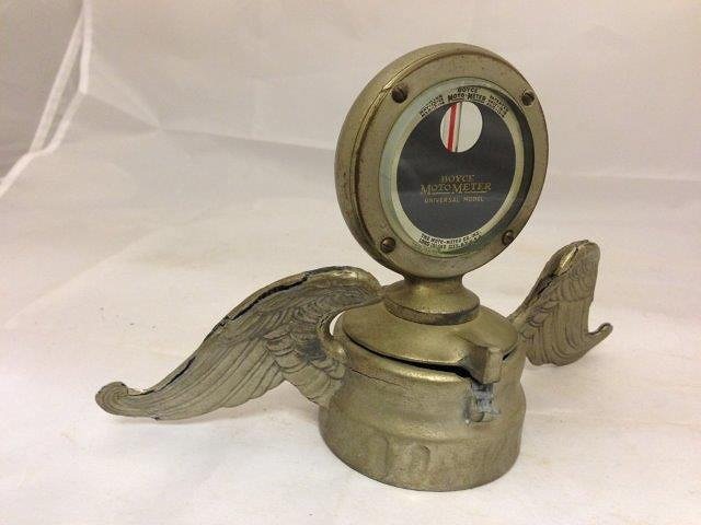 A Boyce Motometer, Universal model on hinged radiator: A Boyce Motometer, Universal model on hinged radiator cap and with wings.