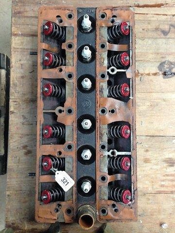 A Riley six cylinder cylinder head, tested with new: A Riley six cylinder cylinder head, tested with new valves and springs.