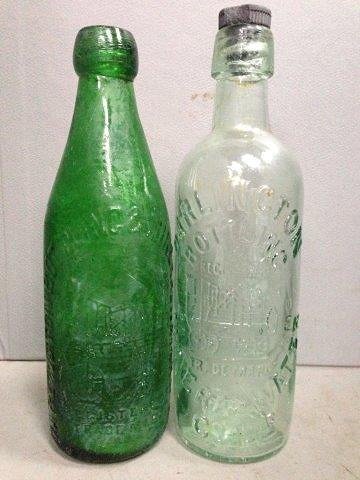 Two Darlington bottling mineral water glass bottles: Two Darlington bottling mineral water glass bottles both with embossed Stevensons Rocket decoration.