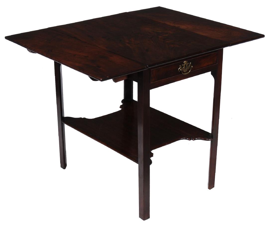 A George III mahogany Pembroke table, circa 1770: A George III mahogany Pembroke table, circa 1770, after a design by Thomas Chippendale, the rectangular top incorporating twin hinged leaves, above a frieze drawer, on square section legs joined by a