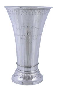 A Swedish silver trophy beaker or vase by Karl: A Swedish silver trophy beaker or vase by Karl Anderson, 1909, with a moulded rim, an engraved swagged band, a beaded lower girdle, on a spreading foot chased with rocaille work, presentation engraved