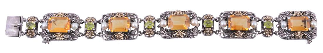 An Arts and crafts citrine, peridot and cultured pearl: An Arts and crafts citrine, peridot and cultured pearl bracelet attributed to Bernard Instone , circa 1930, the rectangular panels with a central step cut citrine with canted corners between two cultu
