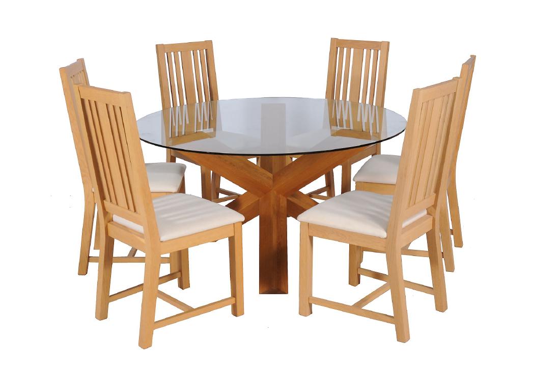 An oak and glass Spyder dining table and six chairs by: An oak and glass Spyder dining table and six chairs by Heal & Son, circa 2006, the table 71cm high, 140cm diameter, the chairs 105cm high Purchased by the present vendor as order no. 02/586583 Spyder