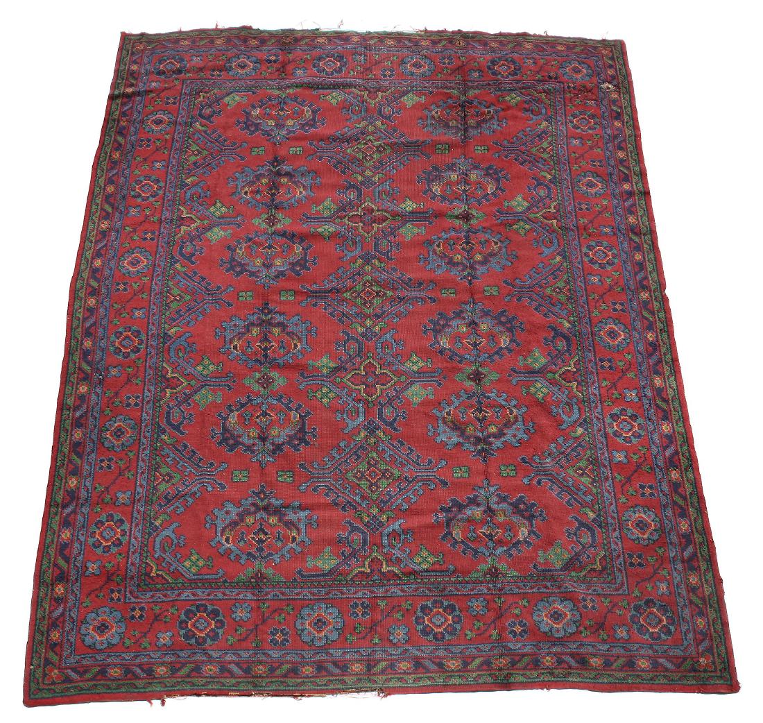 A Donegal 'Turkey' carpet , the crimson field decorated (1 of 2)