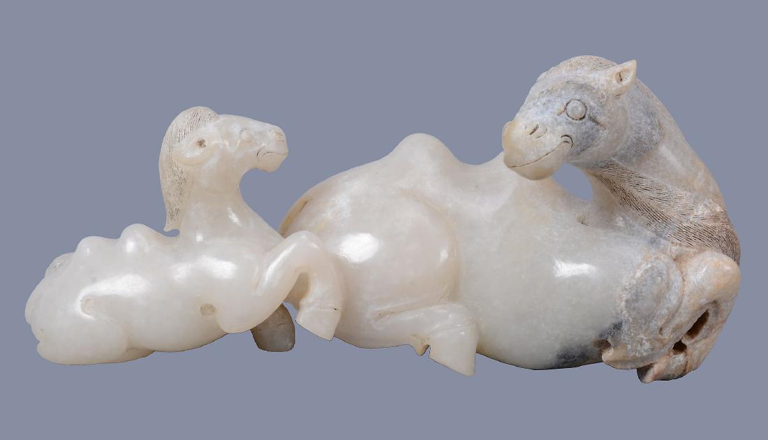 A Chinese white, black and grey jade model of a camel (1 of 5)