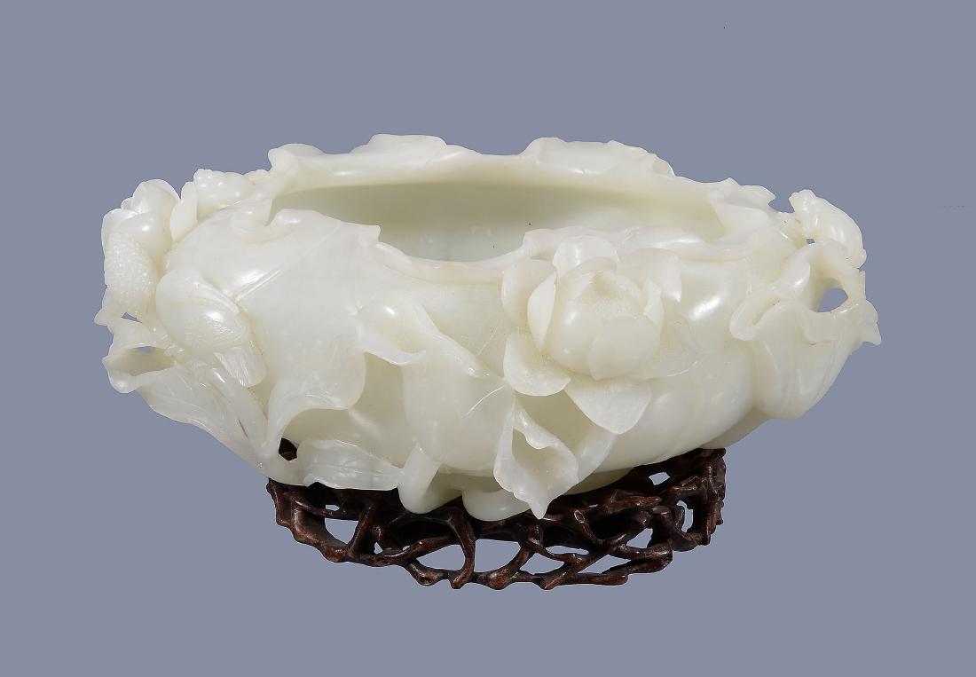 A large Chinese white jade bowl, shaped as a lotus leaf (1 of 8)
