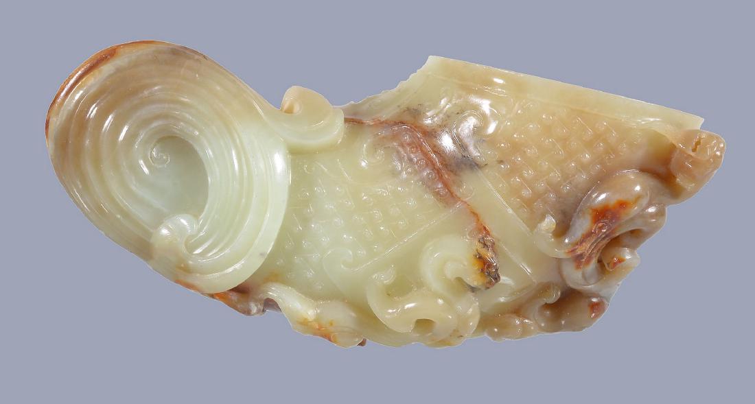A Chinese celadon and russet jade horn-shaped vessel, (1 of 6)