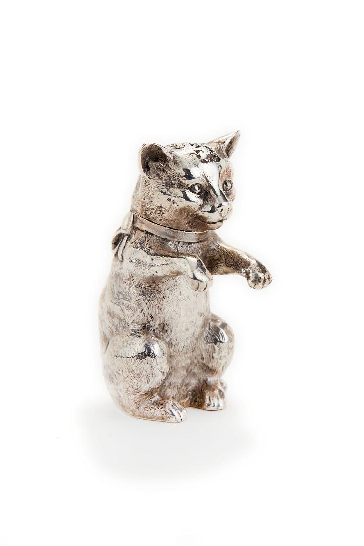 A Victorian silver novelty pepperette by James Barclay: A Victorian silver novelty pepperette by James Barclay Hennell, London 1881, Patent Office Design Registration mark for 20th August 1895, in the form of a cat sitting on its hind haunches, 7.8cm (3in)