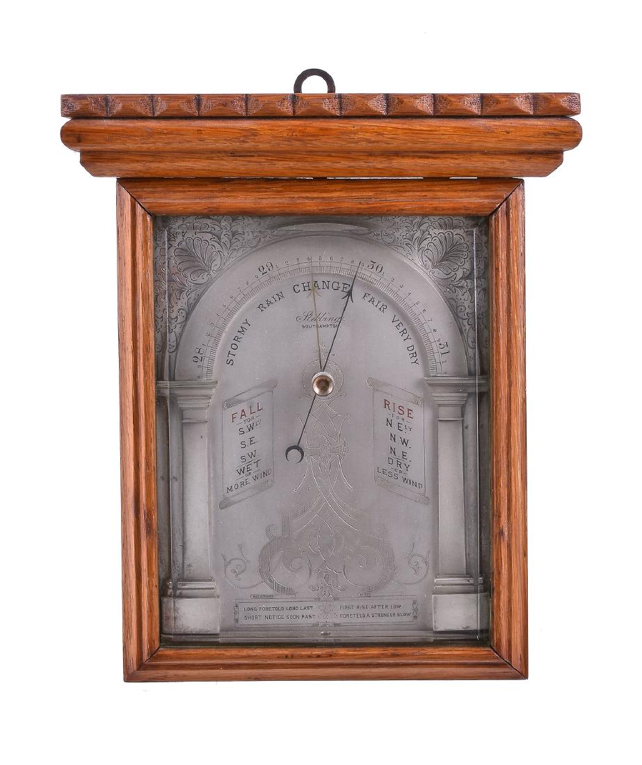 An unusual oak cased aneroid wall barometer possibly (1 of 1)