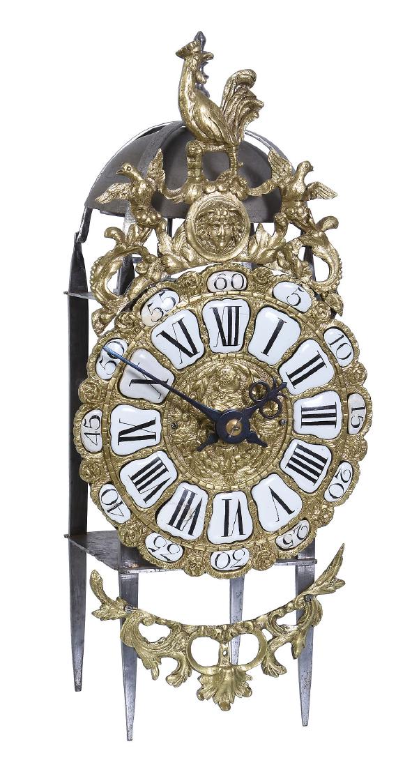 A rare French Louis XV provincial iron framed: A rare French Louis XV provincial iron framed rack-striking lantern clock The bell signed for Jean Dubois, mid 18th century The posted inside rack-striking two handed movement with vertically pivoted
