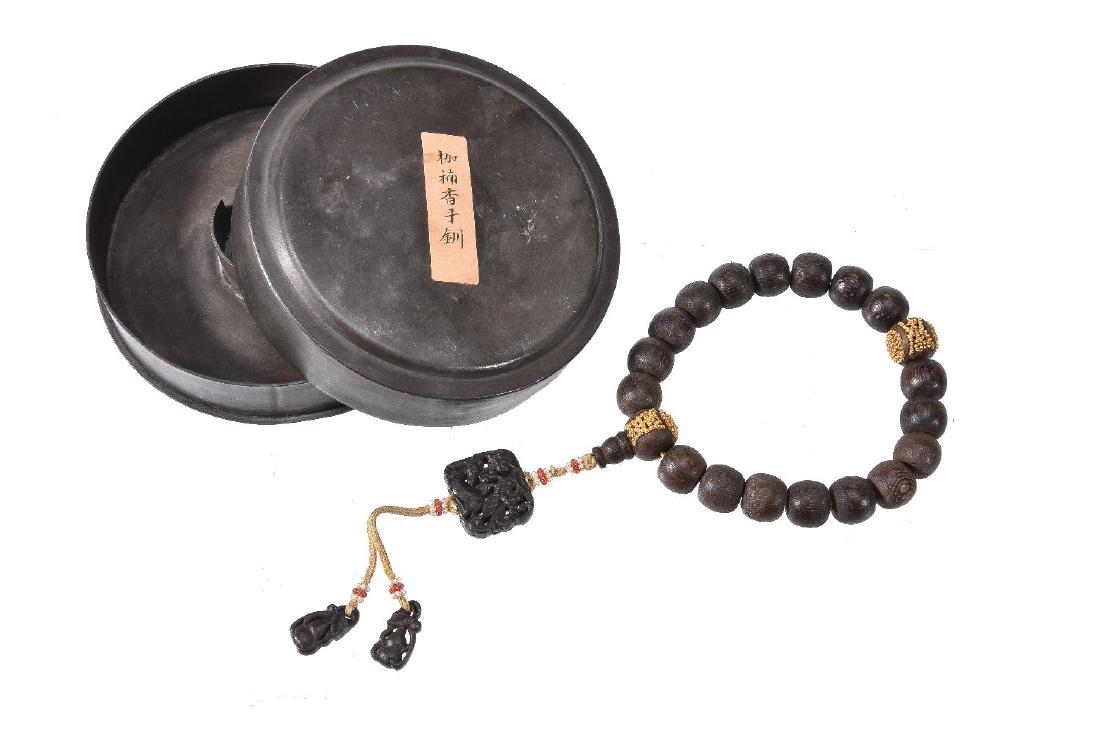A string of Chinese wood rosary beads (1 of 5)