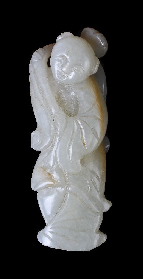 A Chinese celadon and russet jade carving of a boy (1 of 6)