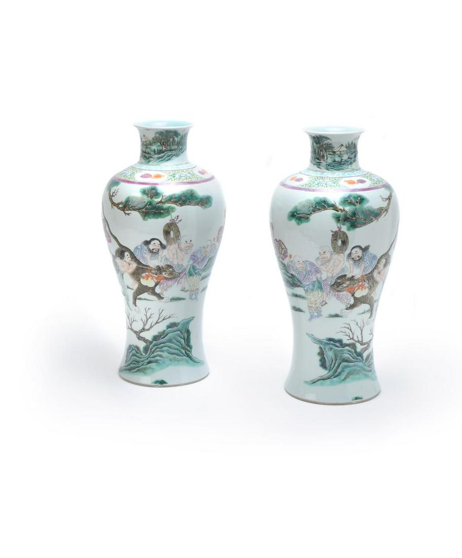 A pair of Chinese Famille Rose 'Taming the Tiger' vases (1 of 4)