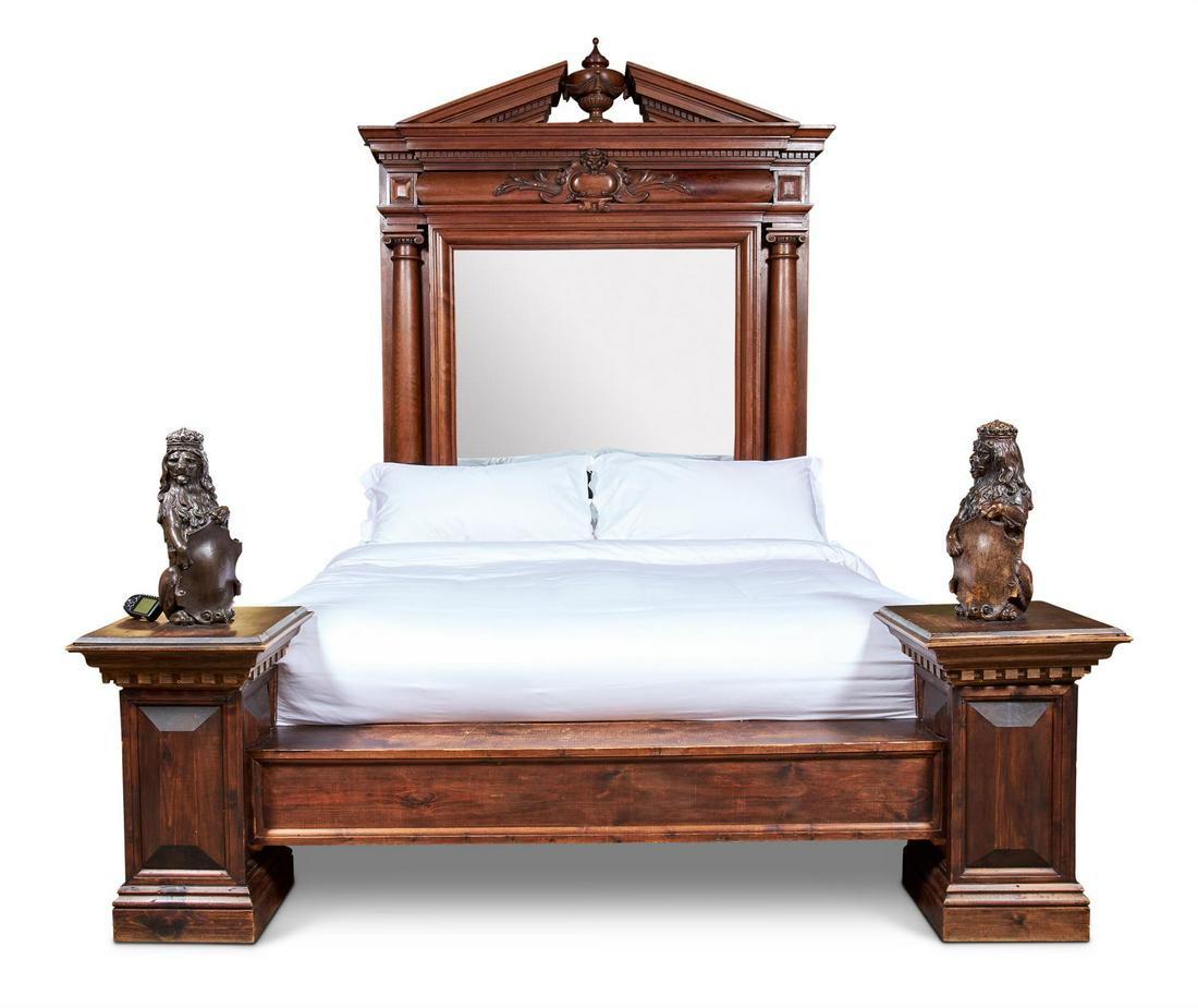 A LARGE CARVED MAHOGANY BED (1 of 1)