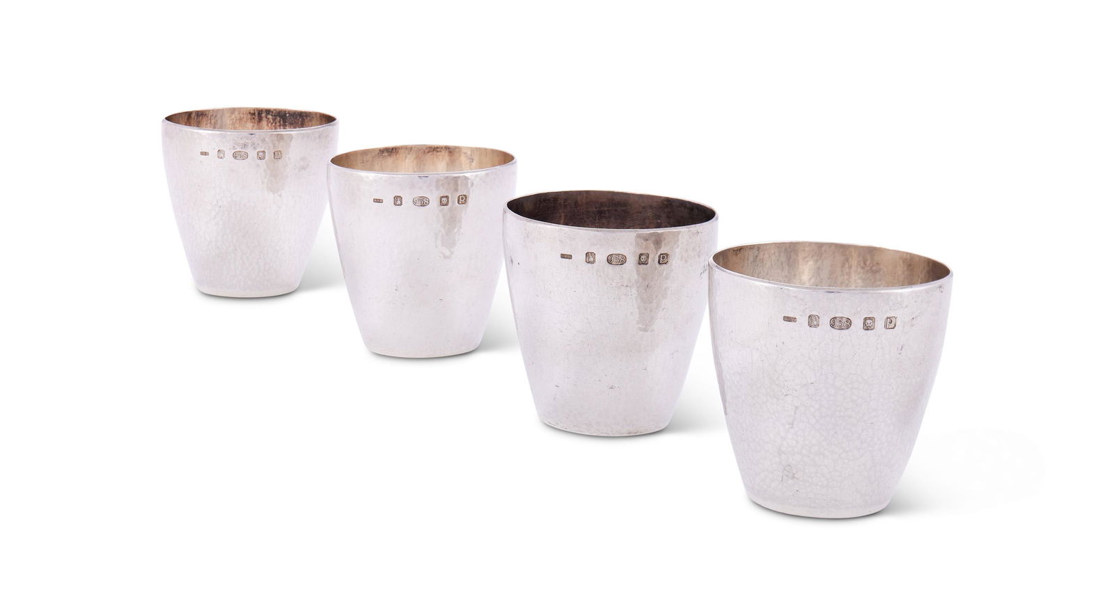 A SET OF FOUR HAMMERED BRITANNIA SILVER SMALL BEAKERS, (1 of 1)