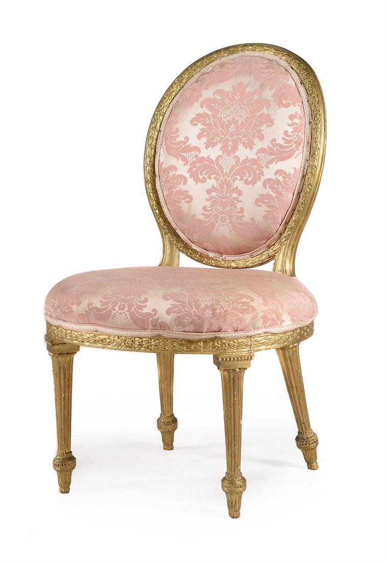 A GEORGE III CARVED GILTWOOD SIDE CHAIR, IN THE MANNER OF THOMAS CHIPPENDALE: A GEORGE III CARVED GILTWOOD SIDE CHAIR IN THE MANNER OF THOMAS CHIPPENDALE, CIRCA 1775 Upholstered in pink damask, with v-shaped notched and slots to the seat rails92cm high, 57cm wide, 47cm deep ove