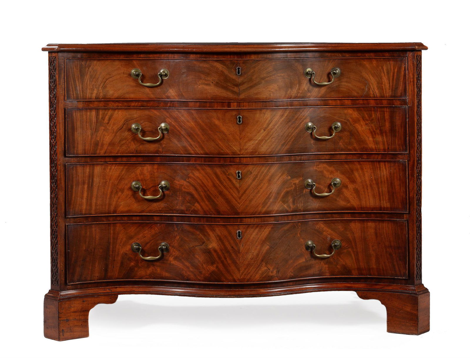 A GEORGE III FIGURED MAHOGANY SERPENTINE DRESSING COMMODE, IN THE MANNER OF THOMAS CHIPPENDALE: A GEORGE III FIGURED MAHOGANY SERPENTINE DRESSING COMMODEIN THE MANNER OF THOMAS CHIPPENDALE, CIRCA 1770The top drawer fitted with a baize inset slide above a fitted drawer containing a central ratche