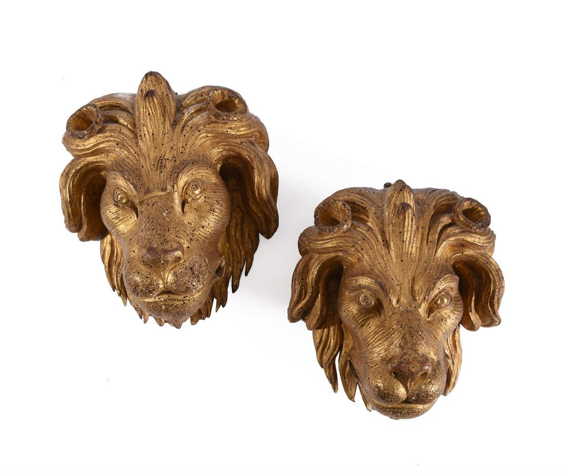 A PAIR OF CARVED GILTWOOD LION MASKS, 18TH CENTURY (1 of 3)