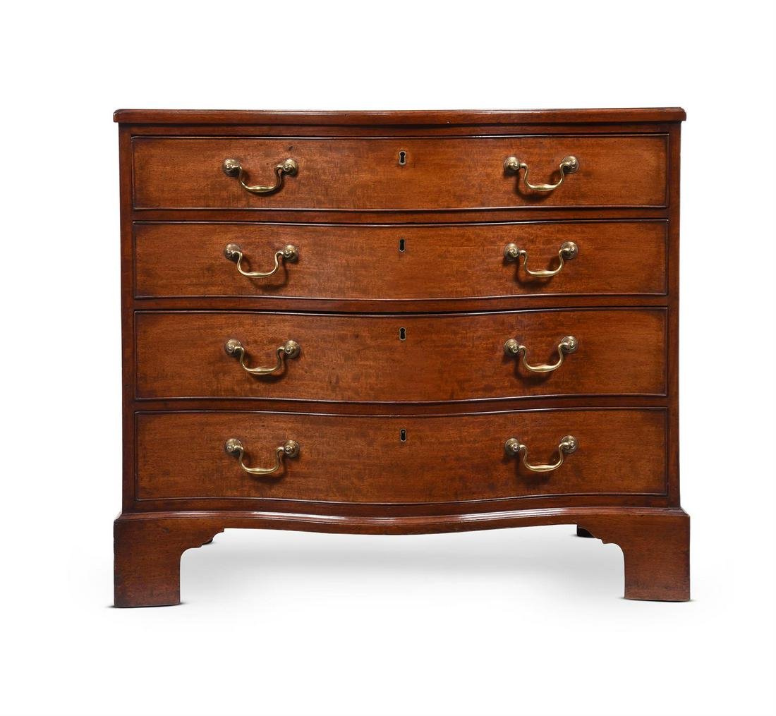 A GEORGE III MAHOGANY SERPENTINE FRONTED COMMODE IN THE MANNER OF THOMAS CHIPPENDALE, CIRCA 1770: A GEORGE III MAHOGANY SERPENTINE FRONTED COMMODE IN THE MANNER OF THOMAS CHIPPENDALE, CIRCA 177082cm high, 94cm wide, 60.5cm deep