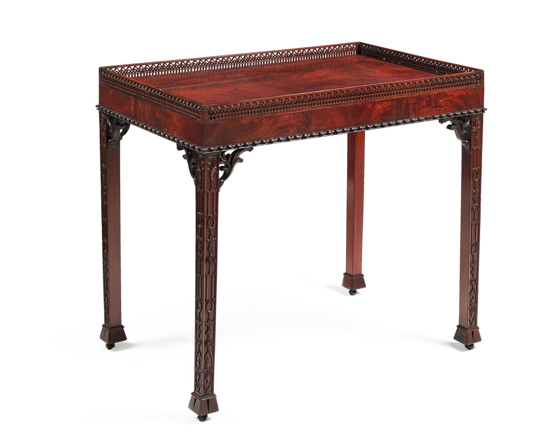 A MAHOGANY SILVER TABLE IN GEORGE III STYLE, IN THE MANNER OF THOMAS CHIPPENDALE, LATE 19TH CENTURY: A MAHOGANY SILVER TABLE IN GEORGE III STYLE, IN THE MANNER OF THOMAS CHIPPENDALE, LATE 19TH CENTURY The pierced gallery above the rectangular top, on blind fretwork legs72cm high, 81cm wide, 55cm deep