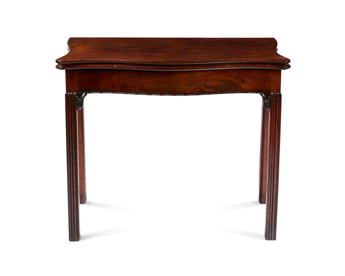 A GEORGE III MAHOGANY CARD TABLE, CIRCA 1780: A GEORGE III MAHOGANY CARD TABLECIRCA 1780, IN THE MANNER OF THOMAS CHIPPENDALE Of serpentine outline, with moulded baize lined twin flap top and plain frieze, on moulded legs headed by carved foliate
