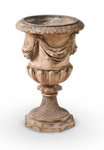 A PLASTER URN IN THE MANNER OF MANIFATTURA DI SIGNA: A PLASTER URN IN THE MANNER OF MANIFATTURA DI SIGNA, 19TH/20TH CENTURY Swag draped body above spiral twist stem 64cm high, the top 41cm diameter