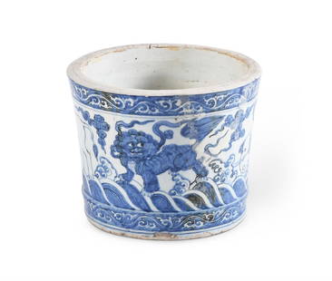 A BLUE AND WHITE BRUSH POT, CHINESE, 17TH CENTURY: A BLUE AND WHITE BRUSH POT CHINESE, 17TH CENTURYPainted with alternating elephants and Buddhist lions19.5cm high, 24cm diameter