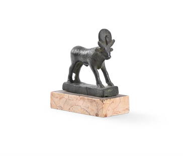AN EGYPTIAN BRONZE FIGURE OF A RUNNING APIS BULL, LATE PERIOD - PTOLEMAIC: AN EGYPTIAN BRONZE FIGURE OF A RUNNING APIS BULLLATE PERIOD - PTOLEMAIC, CIRCA 600-30 B.C. With front legs advanced, set on an integral rectangular base, the body decorated with incised details includ