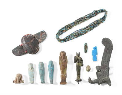 A MISCELLANEOUS GROUP OF EGYPTIAN ANTIQUITIES, CIRCA 1069-30 B.C.: A MISCELLANEOUS GROUP OF EGYPTIAN ANTIQUITIESTHIRD INTERMEDIATE PERIOD - PTOLEMAIC, CIRCA 1069-30 B.C. Including a green glazed faience ring, the bezel moulded with falcon-headed Re-Horakhty standing