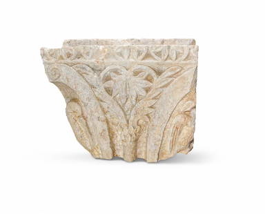 A ROMANESQUE CARVED CORNER CAPITAL IN THE 13TH CENTURY MANNER: A ROMANESQUE CARVED CORNER CAPITAL IN THE 13TH CENTURY MANNER Possibly Istrian stone, carved with foliage and 'pelican in piety', traces of plaster 55cm wide, 45cm high, 39cm deep