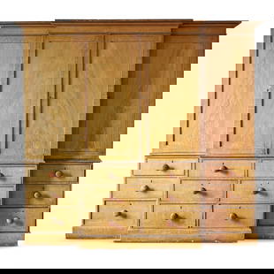 AN ENGLISH PAINTED GRAINED BREAKFRONT WARDROBE, EARLY 19TH CENTURY: AN ENGLISH PAINTED GRAINED BREAKFRONT WARDROBE EARLY 19TH CENTURYScumble painted to simulate wood grain213cm high, 230cm wide, 61cm deep