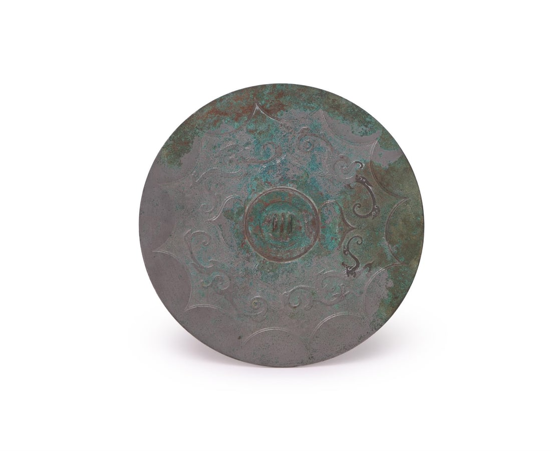 A Chinese bronze 'Dragon and Phoenix' mirror (1 of 3)