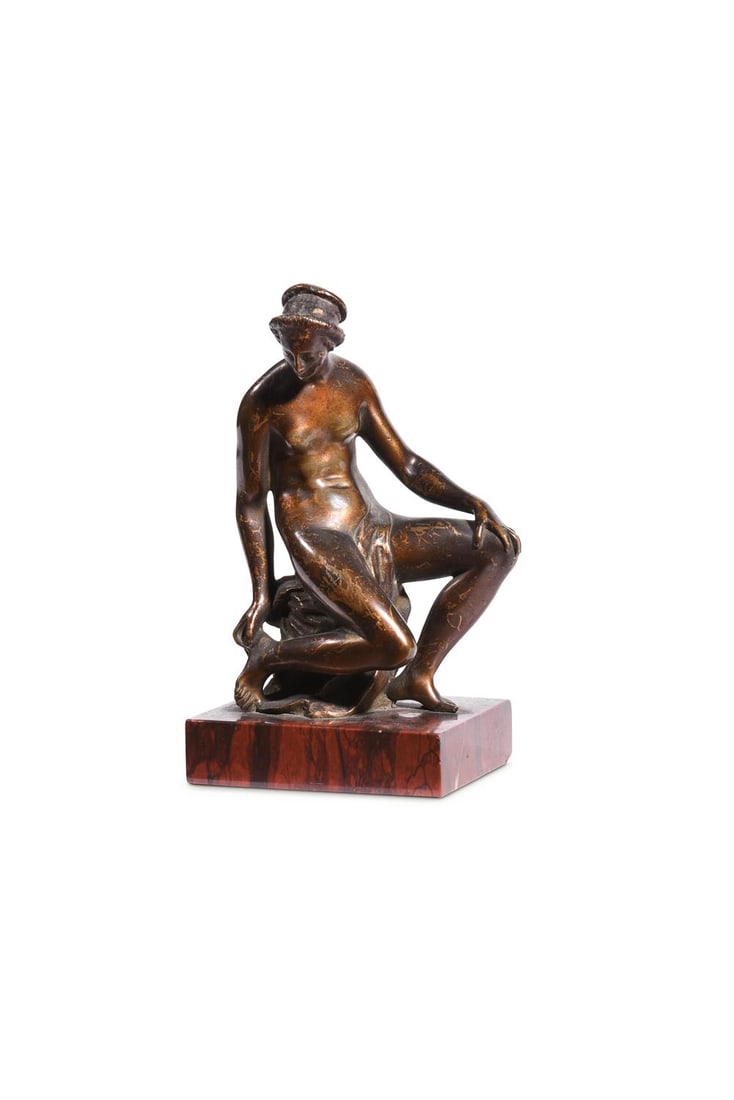 AFTER BARTHELEMY PRIEUR (C.1536-1611) A FRENCH BRONZE FIGURE OF THE SEATED VENUS, 18TH/19TH CENTURY: AFTER BARTHELEMY PRIEUR (C.1536-1611) A FRENCH BRONZE FIGURE OF THE SEATED VENUS 18TH/19TH CENTURY Now on a rouge griotte base 15.5cm high overall, base 8.5cm wide