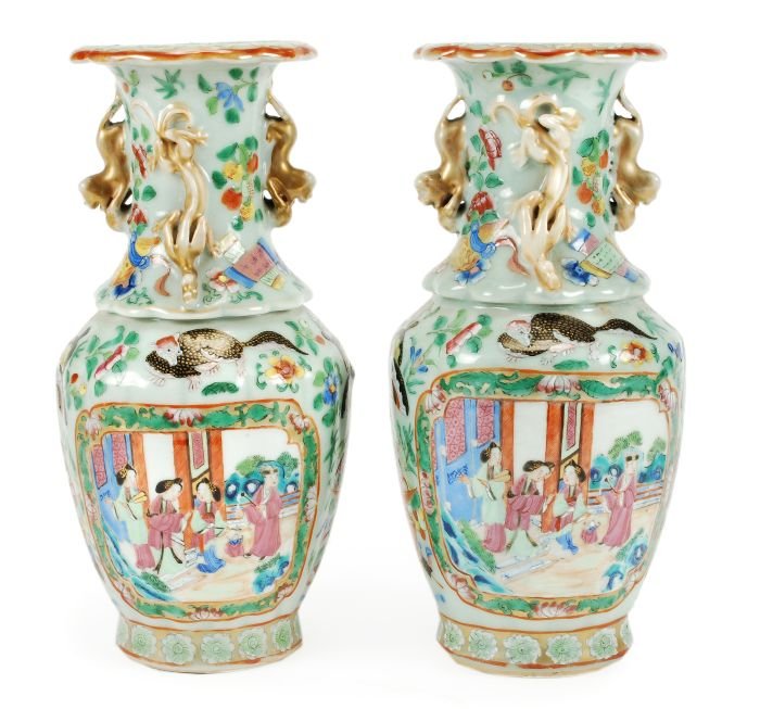 A pair of Chinese celadon glazed Canton vases with: A pair of Chinese celadon glazed Canton vases with foliate rims and moulded Buddhist lions handles and qilin, decorated with gilded panels of figures within garden settings, amidst butterflies and flo