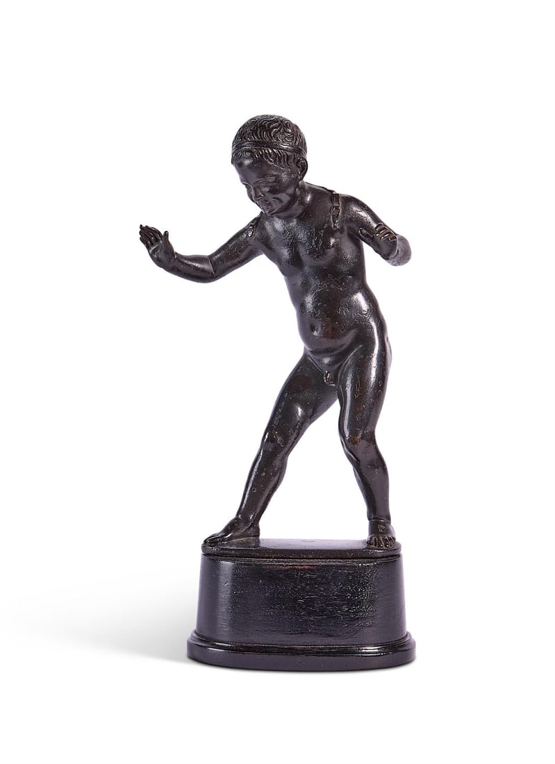 AFTER BARTHELÉMY PRIEUR (1536-1611), A BRONZE FIGURE OF A STANDING BOY, 17TH CENTURY: AFTER BARTHELÉMY PRIEUR (1536-1611) A BRONZE FIGURE OF A STANDING BOY FRENCH, 17TH CENTURY Set on an oval ebonised wood base bronze 19.5cm high, 25cm high overall