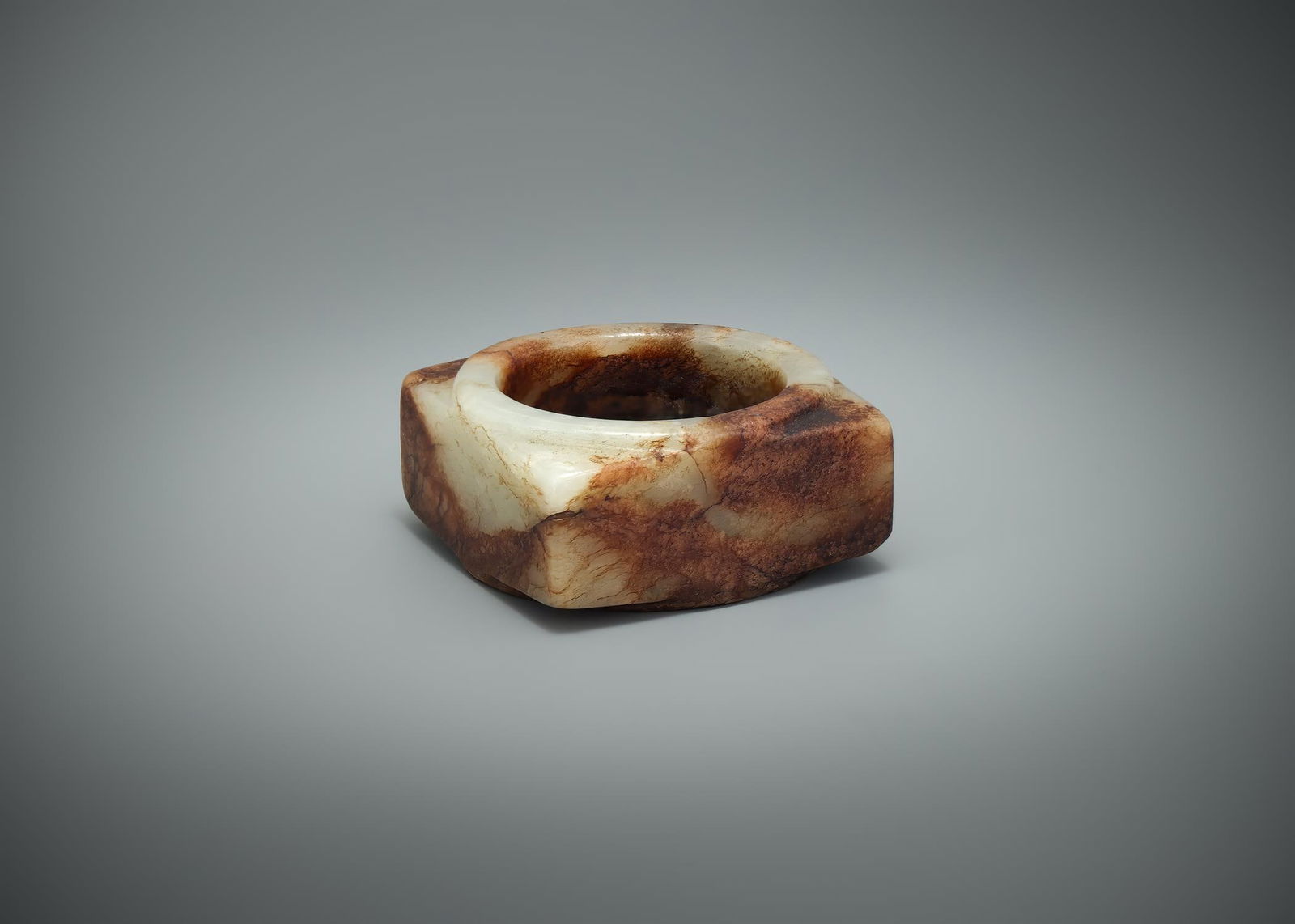 An attractive Chinese small brown and celadon jade Cong (1 of 3)