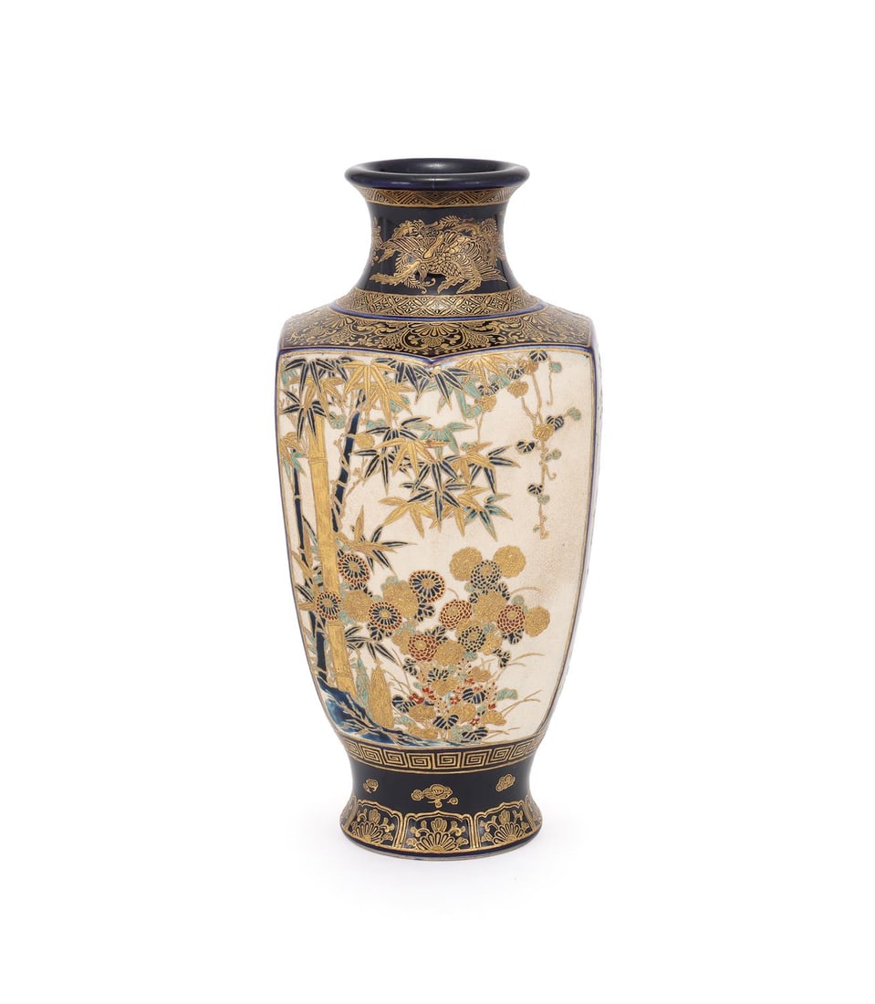 A Satsuma Pottery Vase: A Satsuma Pottery Vase, Meiji Period, of tapered, hexagonal section resting on a splayed foot and rising to a waisted, cylindrical neck, decorated in overglaze enamels on a mazarin blue ground with pa
